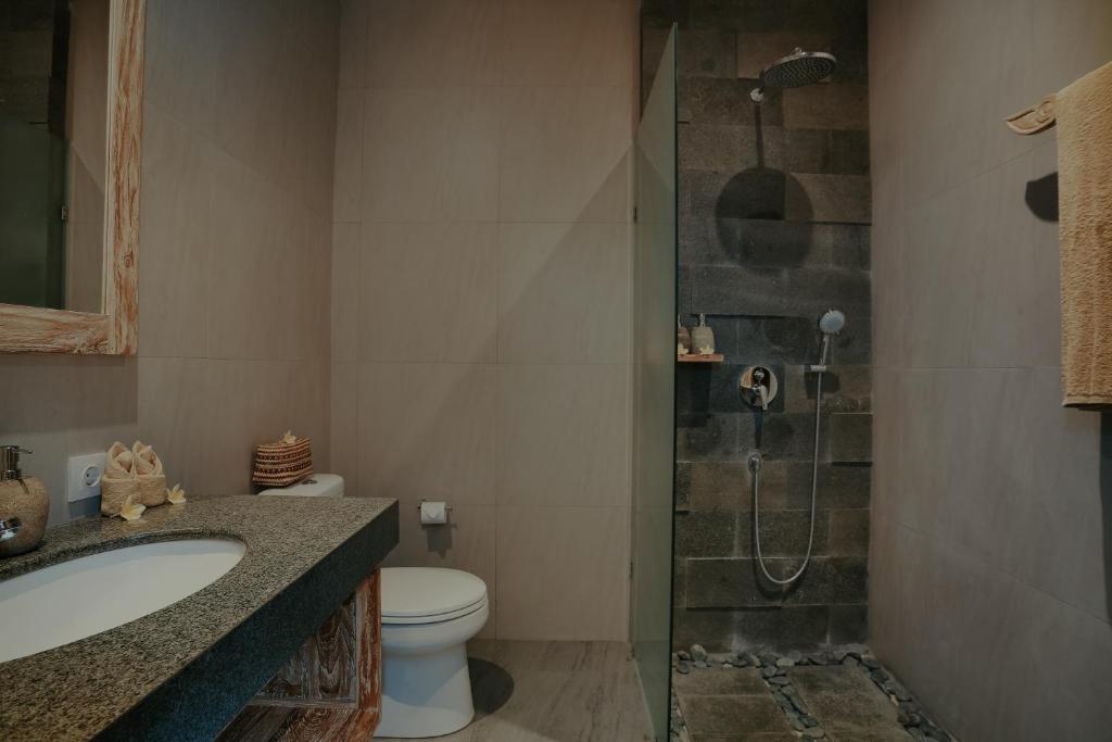 Koupelna v ubytování LASTANA SUITE UBUD