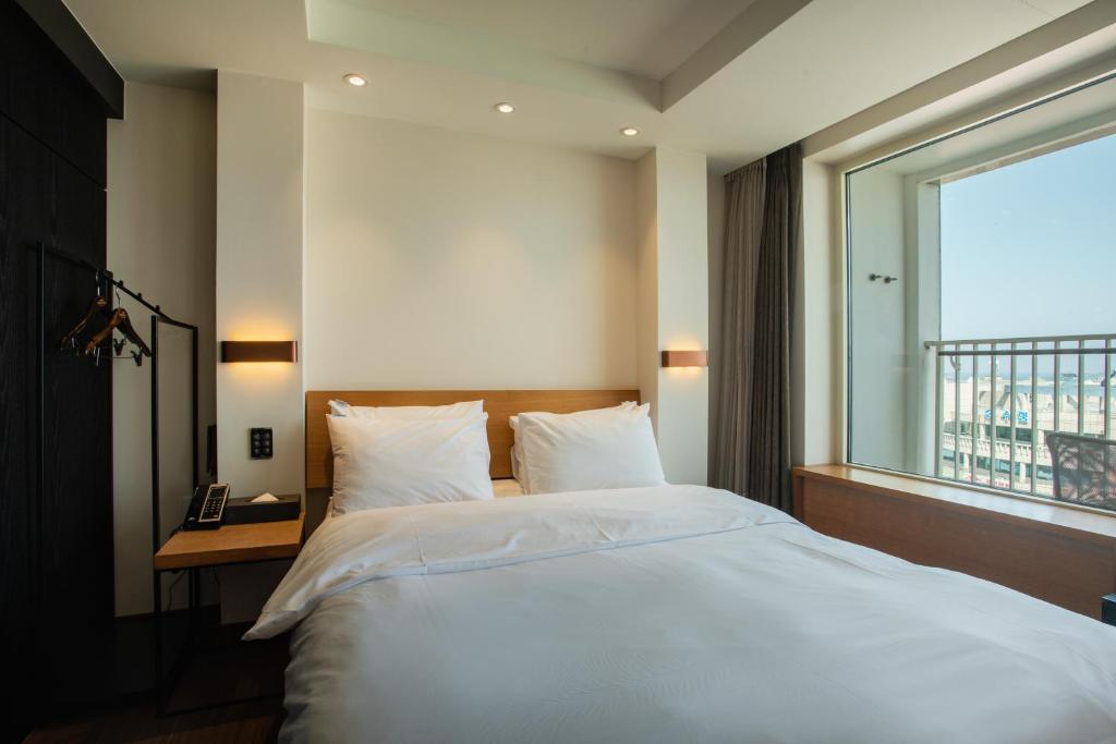 Postel nebo postele na pokoji v ubytování Winners Hotel