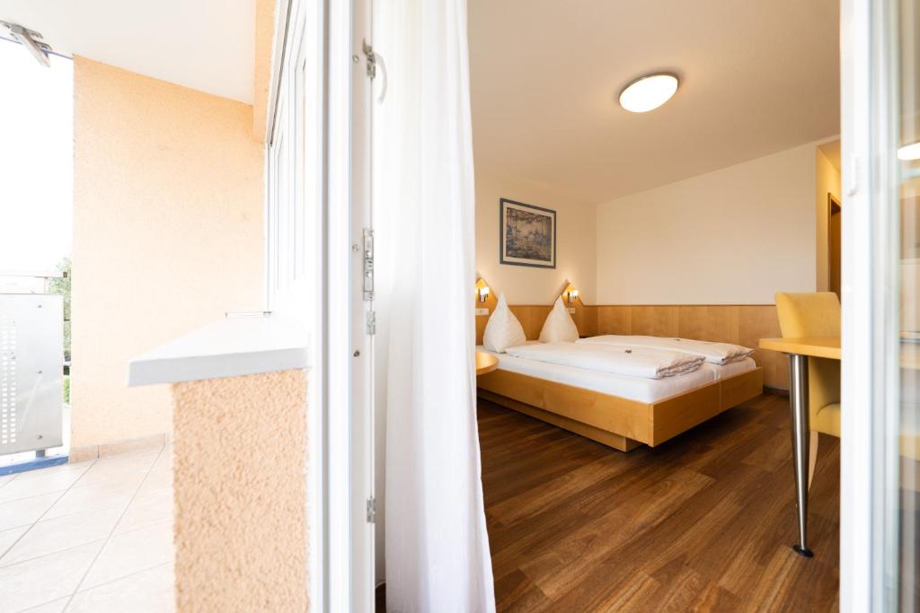 Postel nebo postele na pokoji v ubytování ates Hotel Kehl