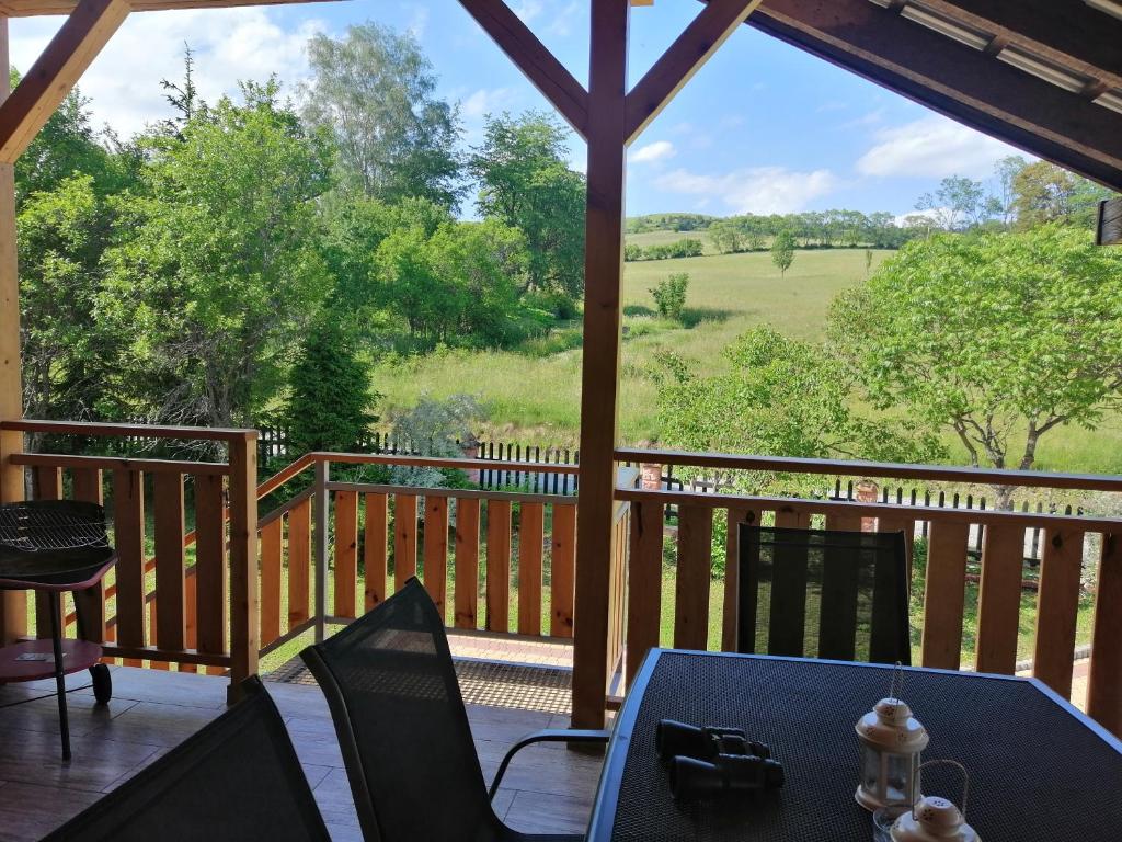 a view from a porch with a table and chairs at Rzepedka in Rzepedż