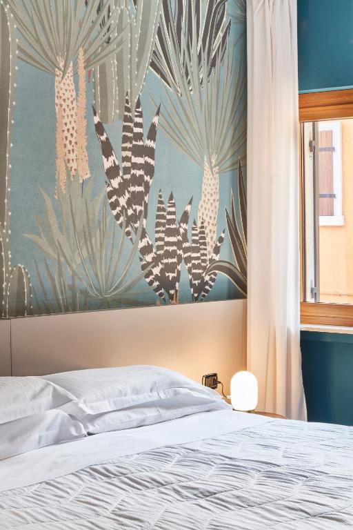 Postel nebo postele na pokoji v ubytování Hotel Astoria