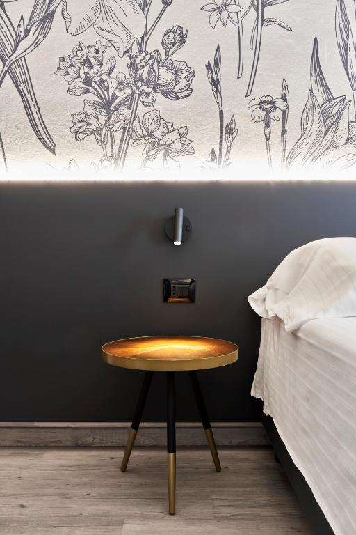 Postel nebo postele na pokoji v ubytování Hotel Astoria
