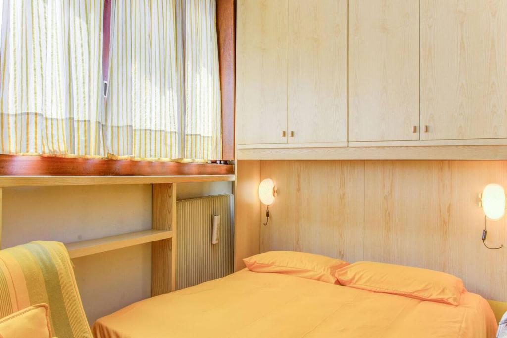 Łóżko lub łóżka w pokoju w obiekcie Condominio Escargot