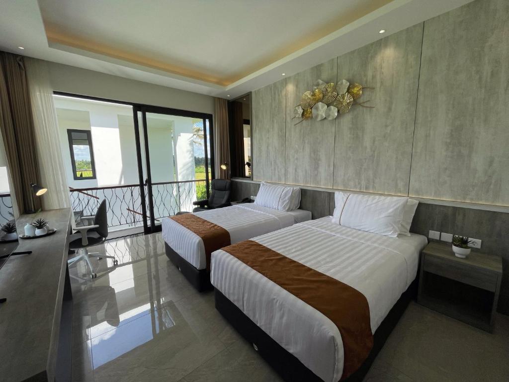 Postel nebo postele na pokoji v ubytování The Valerian Villa Ubud