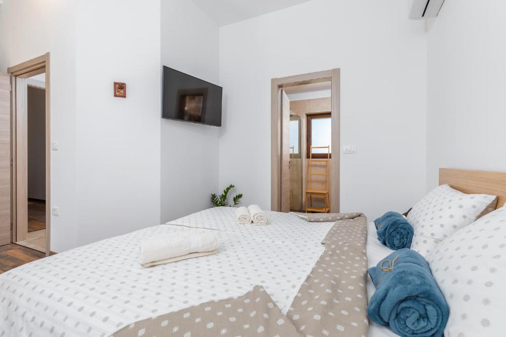 Łóżko lub łóżka w pokoju w obiekcie Rental house Nada