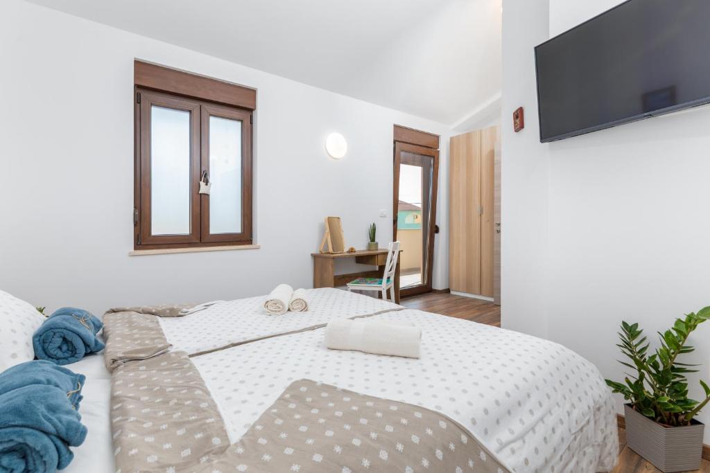 Łóżko lub łóżka w pokoju w obiekcie Rental house Nada