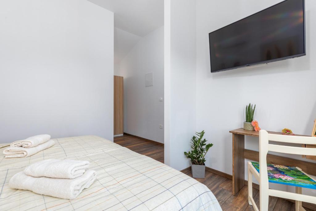 Łóżko lub łóżka w pokoju w obiekcie Rental house Nada