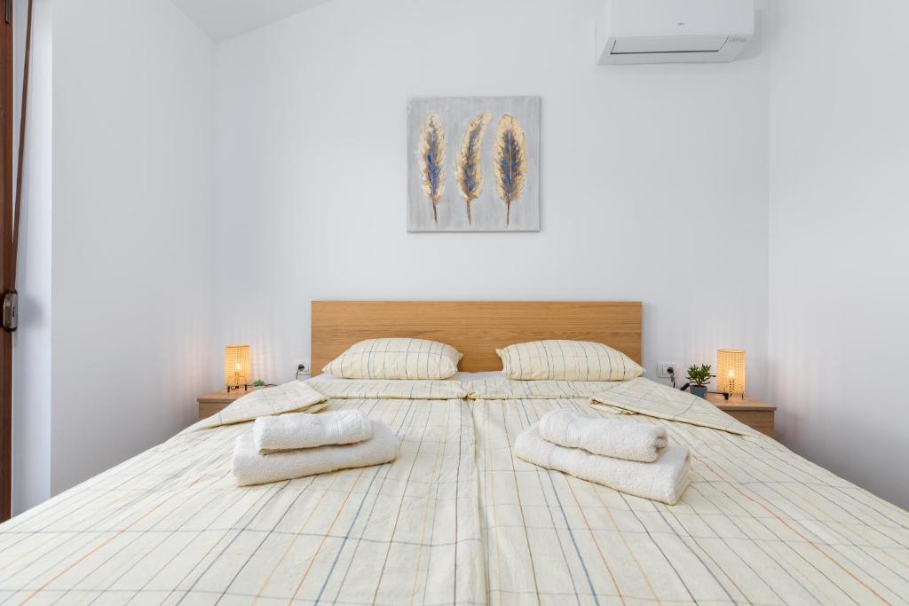 Łóżko lub łóżka w pokoju w obiekcie Rental house Nada