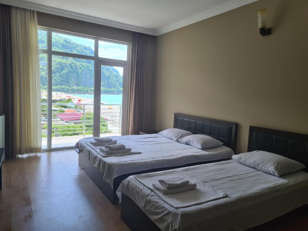Postel nebo postele na pokoji v ubytování Black Sea Hotel