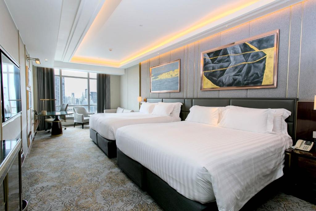 Ein Bett oder Betten in einem Zimmer der Unterkunft Centara Grand At CentralWorld