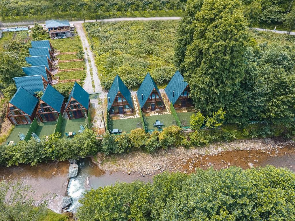 an aerial view of a house with blue roofs at Oce Bungalow in Ardeşen