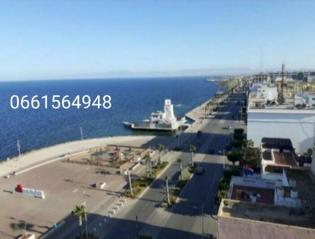 a large boat is docked at a dock in the water at Residence La corniche Étage 4 in Nador