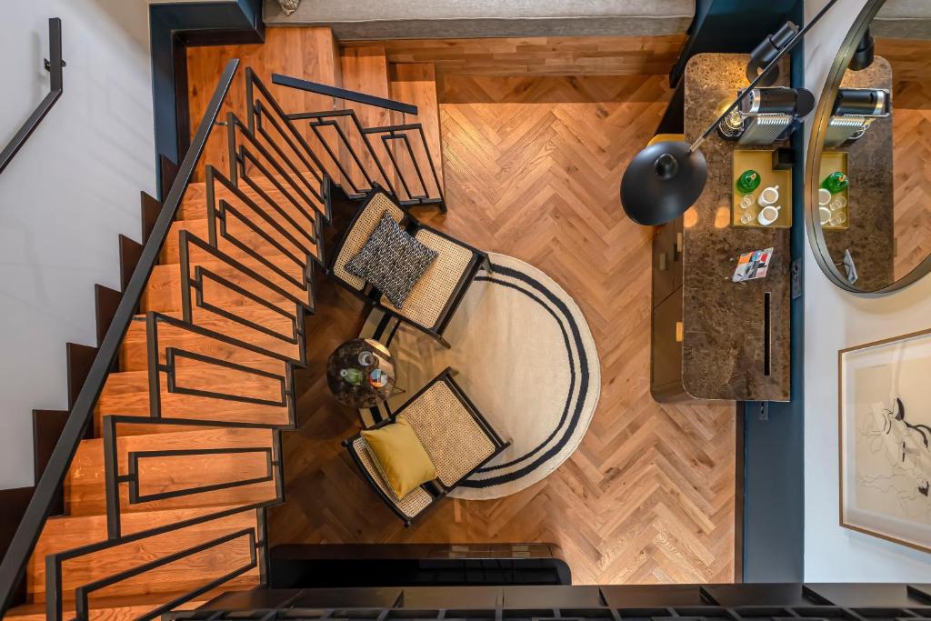 an overhead view of a living room with wooden floors at Backstage Hotel - an Atlas Boutique Hotel in Tel Aviv