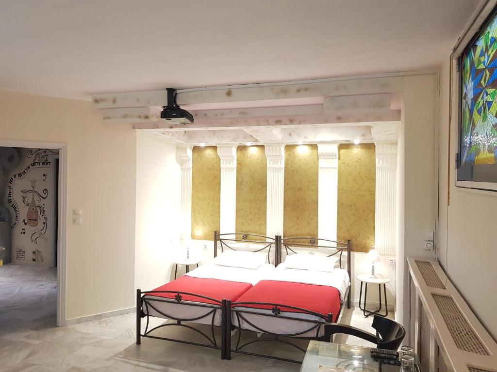 Postel nebo postele na pokoji v ubytování Nomads Rooms