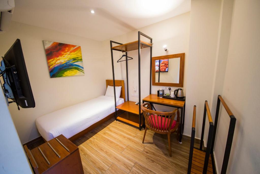 Postel nebo postele na pokoji v ubytování The Point Boutique Hotel
