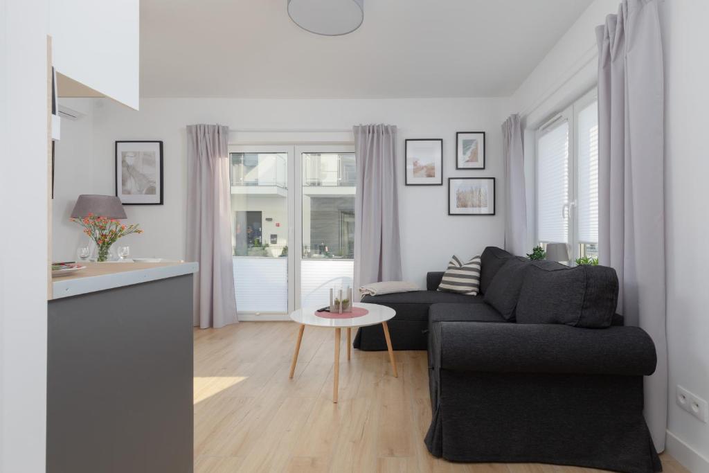 Posezení v ubytování Horizon Park Apartment by Noclegi Renters