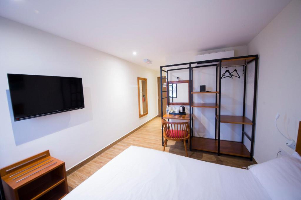 Postel nebo postele na pokoji v ubytování The Point Boutique Hotel