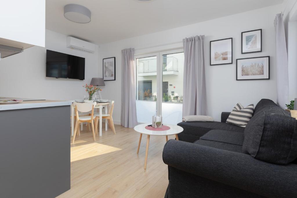 Posezení v ubytování Horizon Park Apartment by Noclegi Renters