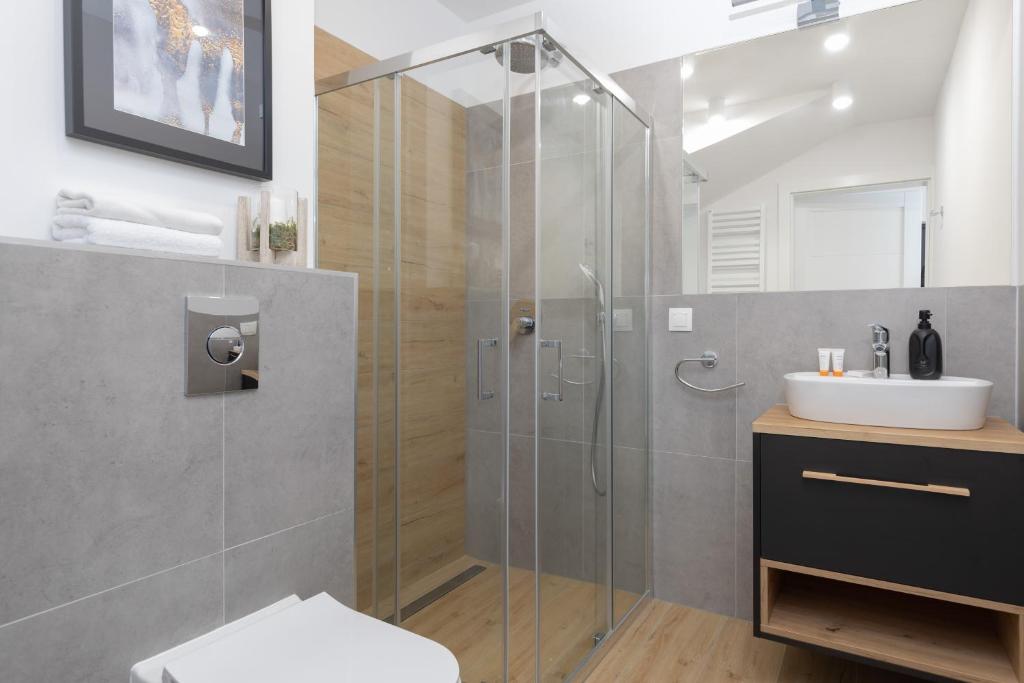 Koupelna v ubytování Horizon Park Apartment by Noclegi Renters