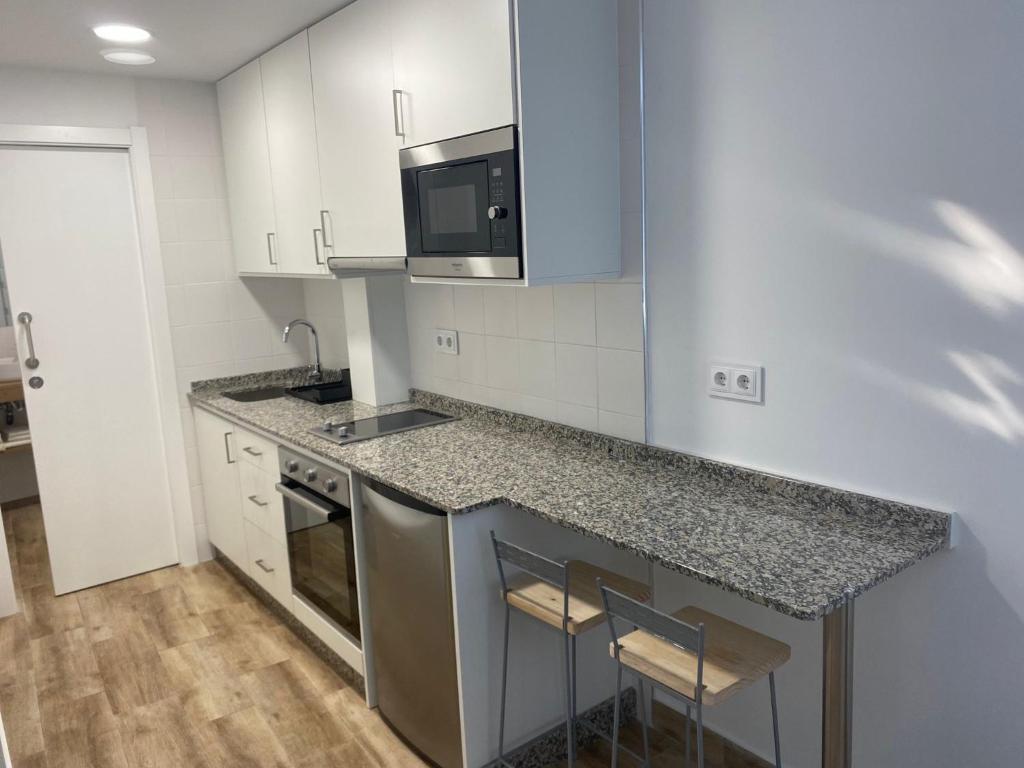 Kuchyňa alebo kuchynka v ubytovaní Apartamentos OLIVA