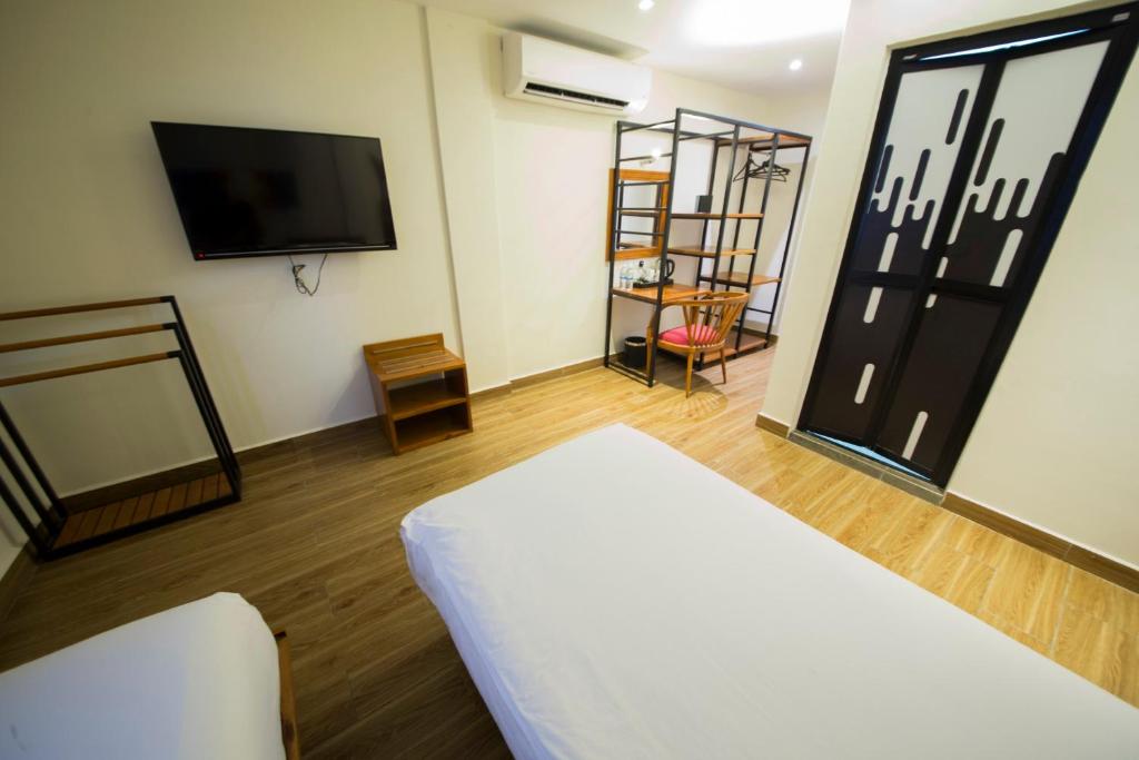 Postel nebo postele na pokoji v ubytování The Point Boutique Hotel