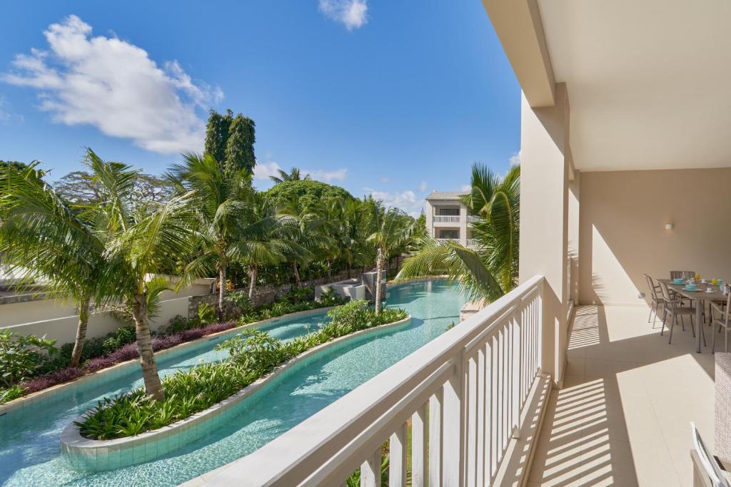 a view of a pool from the balcony of a resort at Ki Residences by 2FUTURES HOLIDAYS in Pereybere