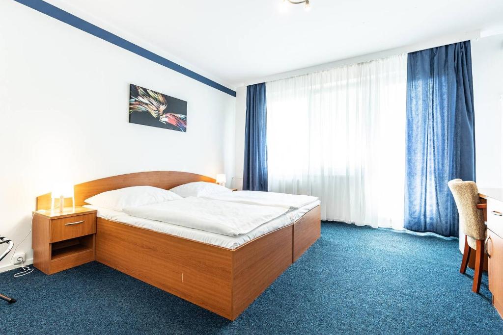 Postel nebo postele na pokoji v ubytování Hotel Krystal