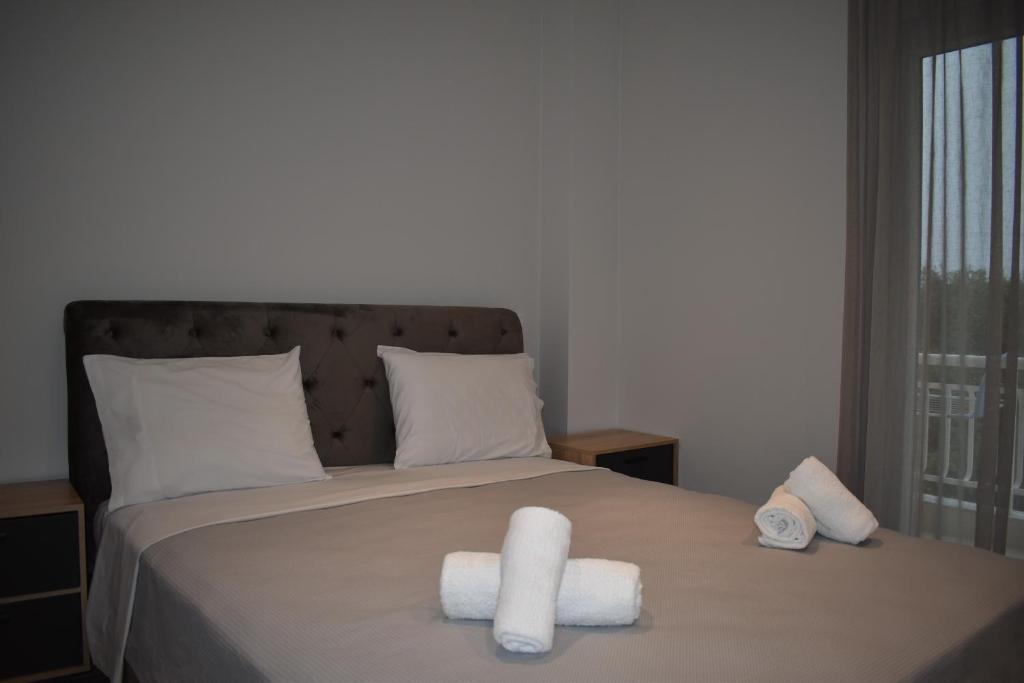 Postel nebo postele na pokoji v ubytování Sea view luxury apartment in Nea Kallikratia.