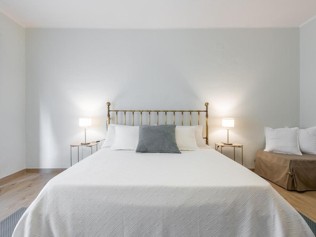 Postel nebo postele na pokoji v ubytování Villa Iole Apartment