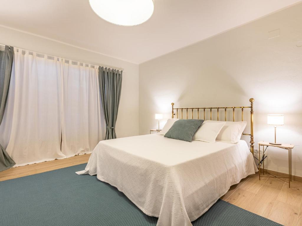 Postel nebo postele na pokoji v ubytování Villa Iole Apartment