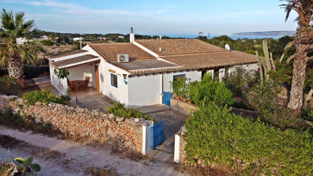 an aerial view of a white house with a stone wall at Ca n'Antonia in Sant Ferran de Ses Roques