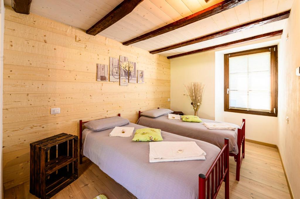 Ένα ή περισσότερα κρεβάτια σε δωμάτιο στο Casa Nonna Pia