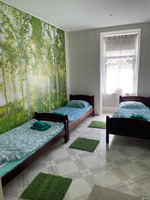 A bed or beds in a room at Viktoria ARTUR