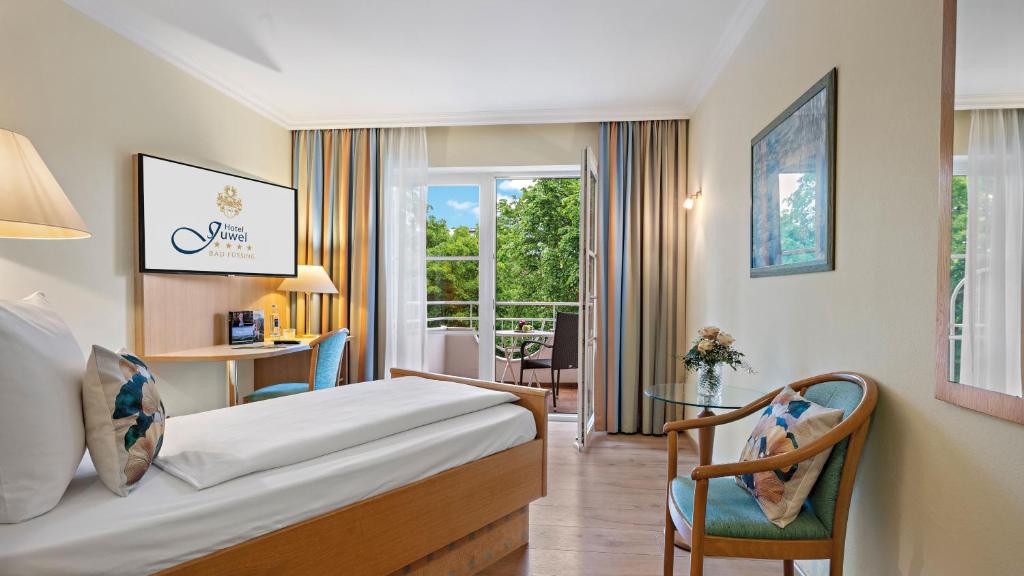 Postel nebo postele na pokoji v ubytování Hotel Juwel