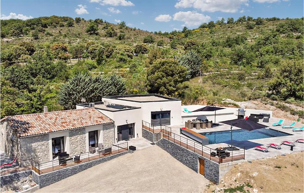 an aerial view of a house with a swimming pool at Gorgeous Home In Alissas With Kitchen in Alissas