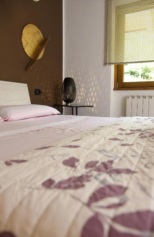 Postel nebo postele na pokoji v ubytování La Casa di Emy