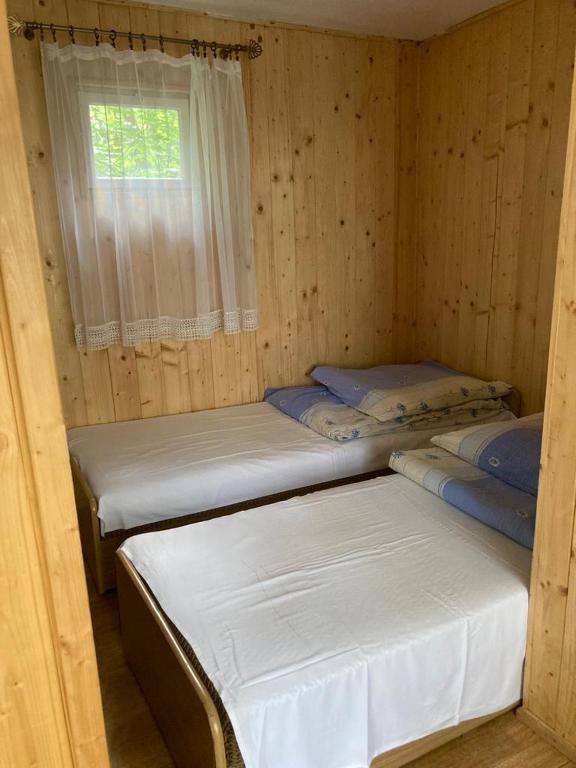 Postel nebo postele na pokoji v ubytování Domki Tęcza