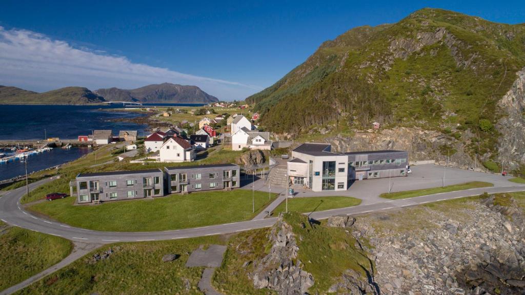 a building on the side of a mountain with a road at Runde Miljøsenter & Opplev Runde in Runde