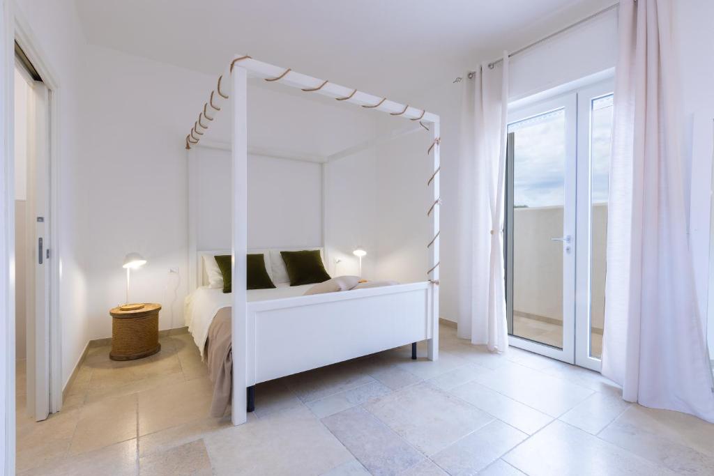 A bed or beds in a room at Valentinus