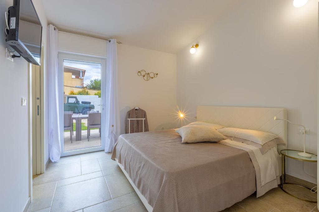A bed or beds in a room at Valentinus