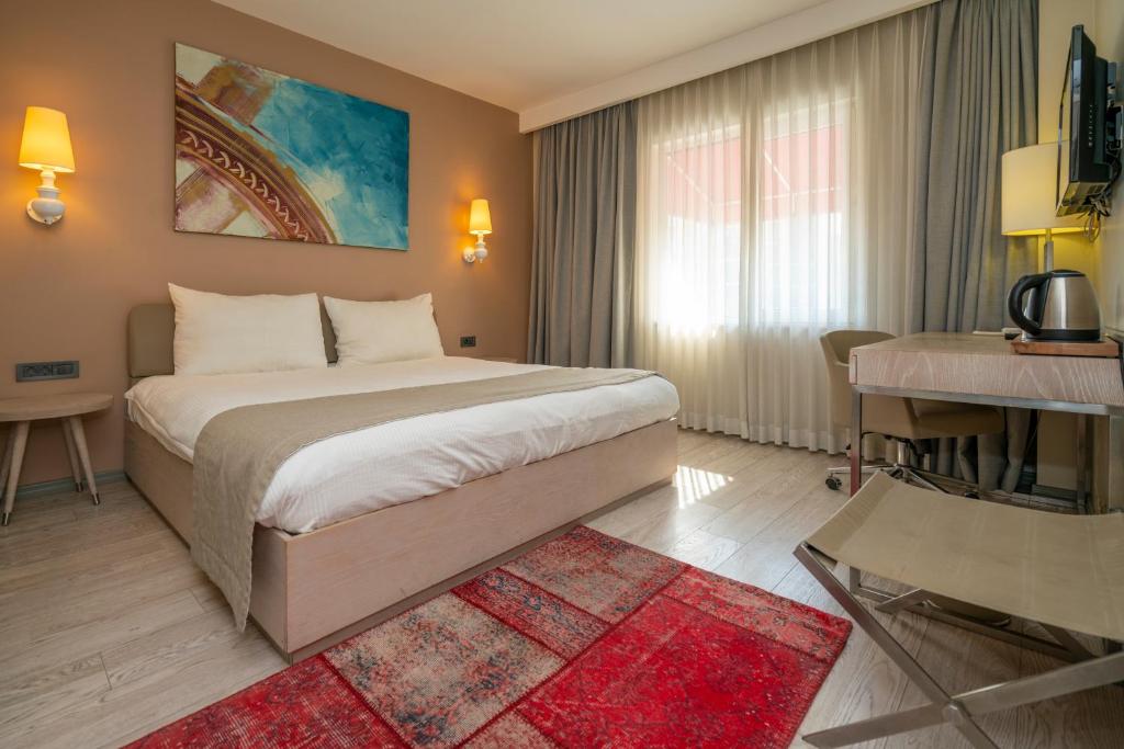 A bed or beds in a room at The Gate Ataşehir Finance Centre