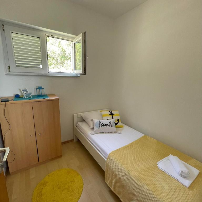 Postel nebo postele na pokoji v ubytování Apartman Emilija
