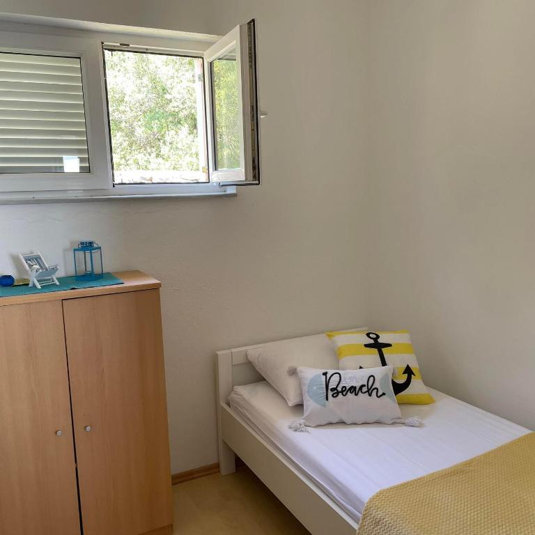 Postel nebo postele na pokoji v ubytování Apartman Emilija