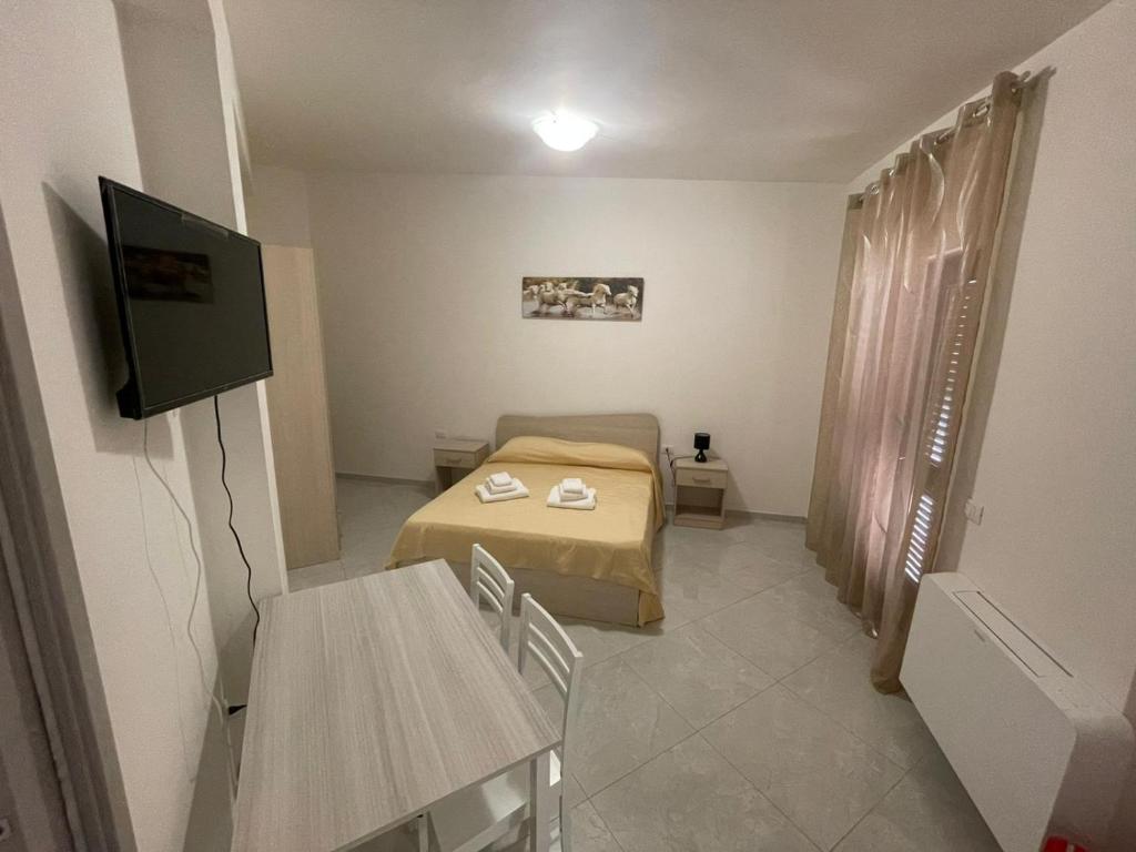 TV a/nebo společenská místnost v ubytování B&B Il Dolce Nido