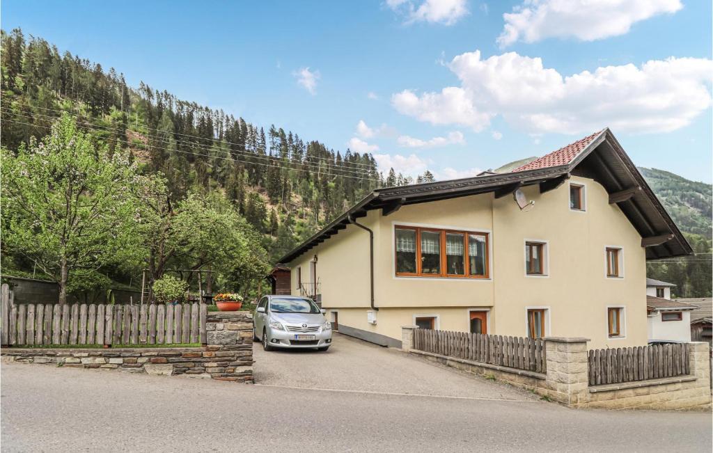a car parked in front of a house at Awesome Apartment In Obervellach With Wifi And 2 Bedrooms in Obervellach