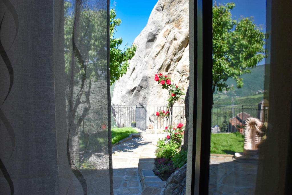 a view from a window of a rock formation at B&B L'Arenaria in Pietrapertosa