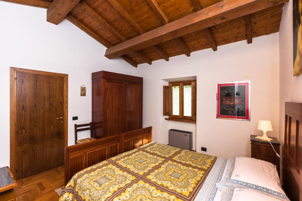 A bed or beds in a room at Podere Montestuccioli
