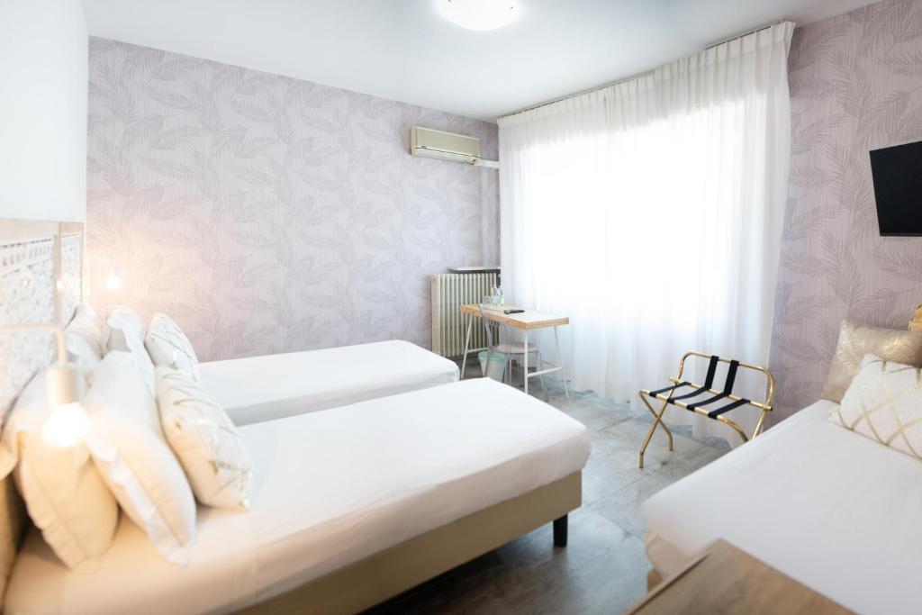 Postel nebo postele na pokoji v ubytování Hotel Brennero