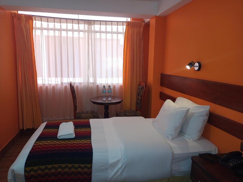 Postel nebo postele na pokoji v ubytování Hotel Rio Dorado MachuPicchu