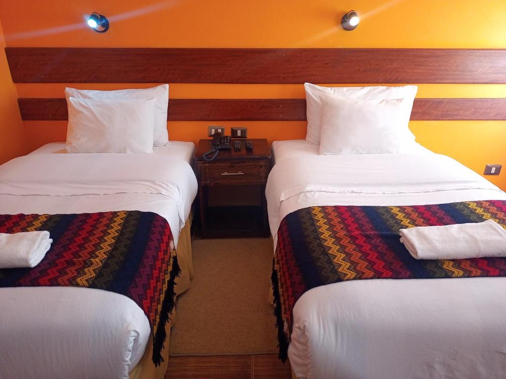Postel nebo postele na pokoji v ubytování Hotel Rio Dorado MachuPicchu